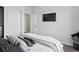 Modern bedroom with flat screen television and neutral tones providing a relaxing retreat at 3453 N Gold Bug Ct, Aurora, CO 80019