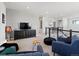 Spacious upper living area featuring modern furniture and neutral tones at 3453 N Gold Bug Ct, Aurora, CO 80019
