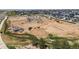 Active construction site with heavy equipment and new homes being built in a Primary-planned community at 3453 N Gold Bug Ct, Aurora, CO 80019