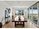 Dining room boasts a large wooden table and sliding glass doors leading to outdoor space at 3453 N Gold Bug Ct, Aurora, CO 80019