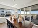 Dining room featuring a wooden table, modern lighting, and sliding glass doors to the outdoor patio at 3453 N Gold Bug Ct, Aurora, CO 80019