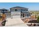 Charming two-story home with a three car garage, nicely landscaped front yard and modern exterior paint at 3453 N Gold Bug Ct, Aurora, CO 80019