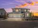 Beautiful two-story home featuring a three-car garage and stone accents, perfect for Gathering living at 3453 N Gold Bug Ct, Aurora, CO 80019