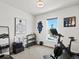 Home gym features exercise equipment, weights, and natural light from a window at 3453 N Gold Bug Ct, Aurora, CO 80019
