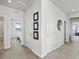 Bright hallway featuring several rooms, white doors and hardware at 3453 N Gold Bug Ct, Aurora, CO 80019