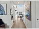 Bright hallway showcasing modern decor and a view of the open living area of the home at 3453 N Gold Bug Ct, Aurora, CO 80019