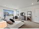 Spacious primary bedroom featuring large window, dresser and comfortable furnishings at 3453 N Gold Bug Ct, Aurora, CO 80019