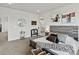 Comfortable primary bedroom featuring neutral tones, ensuite and equestrian decor at 3453 N Gold Bug Ct, Aurora, CO 80019