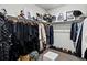 Well-organized walk-in closet with ample hanging space, shelving, and shoe storage, enhanced by stylish accessories at 3453 N Gold Bug Ct, Aurora, CO 80019