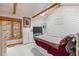 This cozy bedroom features a skylight and a window with forest views at 30264 Upper Bear Creek Rd, Evergreen, CO 80439