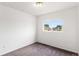This bedroom features a window that provides natural light, carpet and neutral paint at 5168 Goshawk St, Brighton, CO 80601
