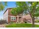 Charming two-story home with manicured lawn and mature trees in a peaceful setting at 5168 Goshawk St, Brighton, CO 80601