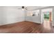 Inviting living room featuring wood floors, white walls, and open floor plan at 5168 Goshawk St, Brighton, CO 80601