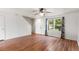 Comfortable living room with wood floors, white walls, and natural light at 5168 Goshawk St, Brighton, CO 80601