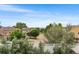 Residential street view of neighborhood with mature trees and sidewalks at 5168 Goshawk St, Brighton, CO 80601