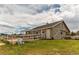 Barn features a sliding door, a pen, and a rustic aesthetic with exposed beams and natural light at 10393 Deerfield Rd, Franktown, CO 80116