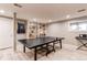 Finished basement featuring a ping pong table, built-in shelves, and modern flooring at 10393 Deerfield Rd, Franktown, CO 80116