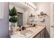 Bathroom featuring a large mirror, double sinks, and decorative accents at 10393 Deerfield Rd, Franktown, CO 80116