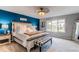 Serene bedroom with a king-size bed, designer bedding, and natural light from the large windows at 10393 Deerfield Rd, Franktown, CO 80116