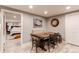 Dining room with a wooden table, chairs, and view into the basement bedroom at 10393 Deerfield Rd, Franktown, CO 80116