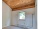 Carpeted bedroom with a window and wood ceiling at 166 S Fuller Placer Rd # 5, Breckenridge, CO 80424