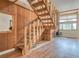 Wood staircase with wood paneled walls and hardwood floors at 166 S Fuller Placer Rd # 5, Breckenridge, CO 80424