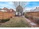 Spacious backyard with lush grass, patio dining, and modern fencing, creating an inviting outdoor oasis at 3339 Tejon St, Denver, CO 80211