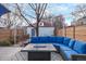 Backyard area with blue sectional couch and an outdoor fire pit at 3339 Tejon St, Denver, CO 80211