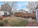 Expansive backyard featuring a well-maintained lawn, patio with seating, and privacy fencing, great for outdoor activities at 3339 Tejon St, Denver, CO 80211