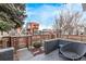 Private backyard patio with stylish seating and a modern fence, perfect for outdoor relaxation at 3339 Tejon St, Denver, CO 80211