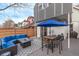 Backyard patio with outdoor dining area and seating area, perfect for entertaining and relaxation, fenced for privacy at 3339 Tejon St, Denver, CO 80211