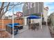 Backyard patio with a dining table, outdoor seating, and a grill, perfect for entertaining, with a wooden fence at 3339 Tejon St, Denver, CO 80211