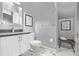 Bathroom featuring a sink, toilet, and decorative artwork at 3339 Tejon St, Denver, CO 80211