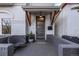 Welcoming front porch with modern door, seating and architectural brick detail at 3339 Tejon St, Denver, CO 80211