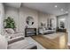 Bright living room with sleek hardwood floors, textured wallpaper, and contemporary furnishings offers a relaxing atmosphere at 3339 Tejon St, Denver, CO 80211