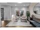 Cozy sitting area features two plush armchairs, a stylish rug, and natural light, creating an inviting space to unwind at 3339 Tejon St, Denver, CO 80211