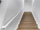 Clean, straight stairs with wood treads and white risers and railings at 3339 Tejon St, Denver, CO 80211