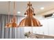 Copper pendant lighting fixtures over a kitchen island, providing warm and stylish illumination at 2572 Iola St, Aurora, CO 80010