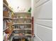 Walk-in pantry with ample shelving, basket storage, and countertop space for convenient organization at 2572 Iola St, Aurora, CO 80010