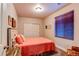 Cozy bedroom with a full-sized bed, window with blind, and closet with sliding doors at 3375 Starry Night Loop, Castle Rock, CO 80109