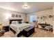 Well-lit bedroom featuring stylish decor, musical instruments, and comfortable furnishings at 3375 Starry Night Loop, Castle Rock, CO 80109