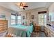 Comfortable bedroom featuring three large windows and carpeted floors at 3375 Starry Night Loop, Castle Rock, CO 80109