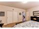 Neutral bedroom with closet and en suite door with carpet flooring and bench at 3375 Starry Night Loop, Castle Rock, CO 80109