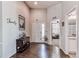 Bright entryway with hardwood floors, high ceilings, and access to a bathroom and sitting room at 3375 Starry Night Loop, Castle Rock, CO 80109