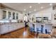 Bright, open kitchen featuring white cabinets, granite countertops, and stainless steel appliances at 3375 Starry Night Loop, Castle Rock, CO 80109