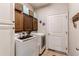 Functional laundry room with modern washer and dryer units and built-in storage cabinets at 3375 Starry Night Loop, Castle Rock, CO 80109