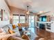 Spacious living room featuring a fireplace, hardwood floors, and an open layout at 3375 Starry Night Loop, Castle Rock, CO 80109