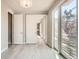 Bedroom featuring a sliding barn door and sliding glass doors to an outdoor balcony at 701 E 24Th Ave, Denver, CO 80205