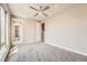 Bedroom featuring a ceiling fan, neutral paint, and carpeted floors at 701 E 24Th Ave, Denver, CO 80205