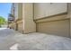 Modern townhome garages featuring neutral color doors and exteriors, perfect for secure parking at 701 E 24Th Ave, Denver, CO 80205